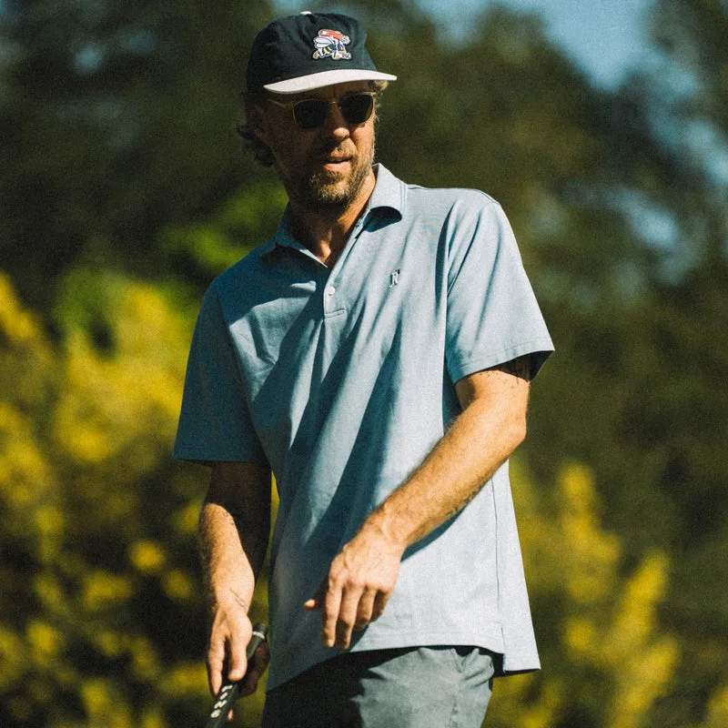 Random Golf Club member polo in retro blue