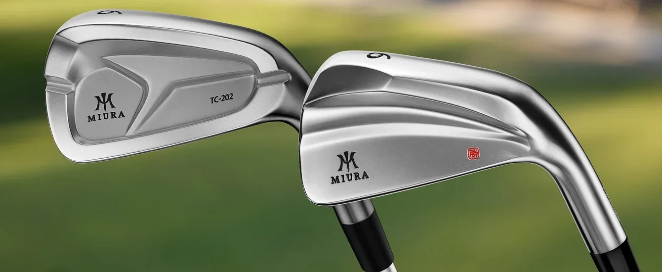 A Miura TC-202 iron beside a KM-700 iron against a green background.