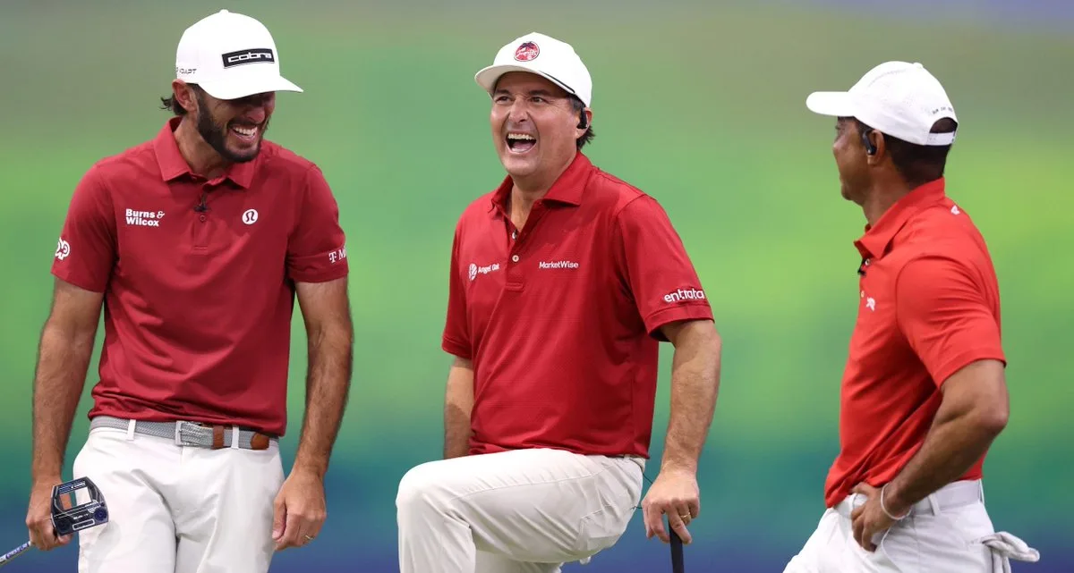 Kevin Kisner, centre, laughing alongside two teammates in red team kit during a TGL match.
