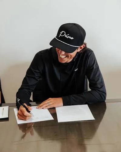 Grant Horvat signing his ownership deal with Primo Golf