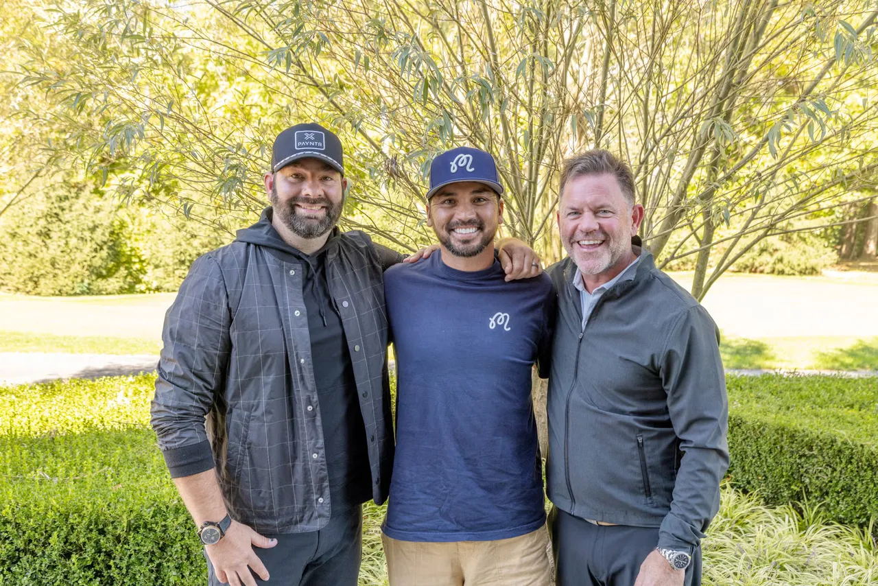 Three men standing together outdoors: Michael Glancy Jr. on the left, Jason Day in the centre and Mike Forsey on the right.