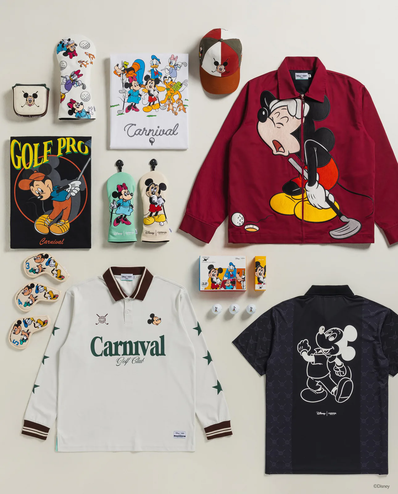 Carnival Golf x Disney Never Outgrow Play collection laid out flat, with a Golf Pro Mickey tee, a red embroidered Mickey jacket, a Carnival Golf Club polo, numbered iron covers and branded golf balls