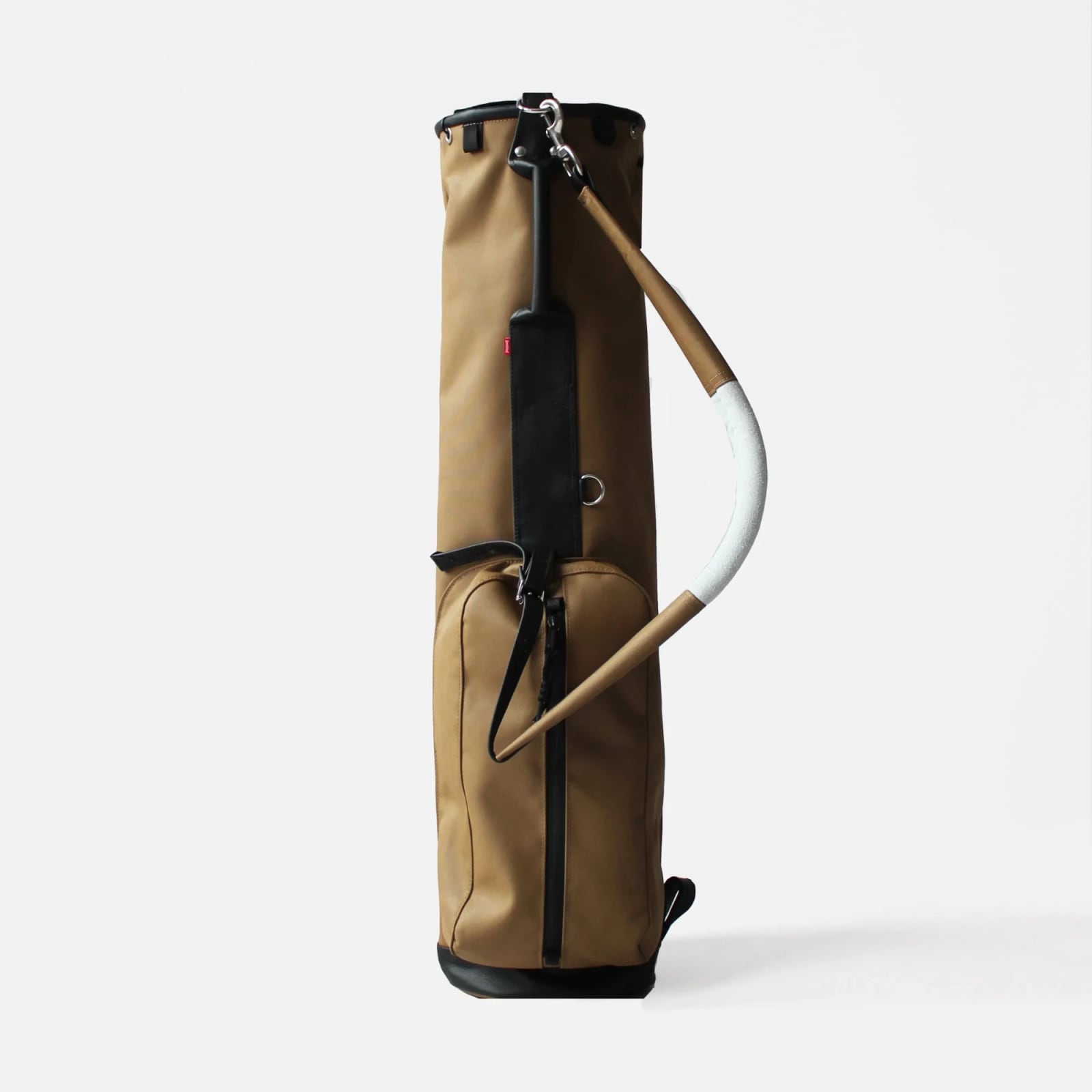 A tan Sentinel Golf carry bag with black leather trim and a curved stand leg